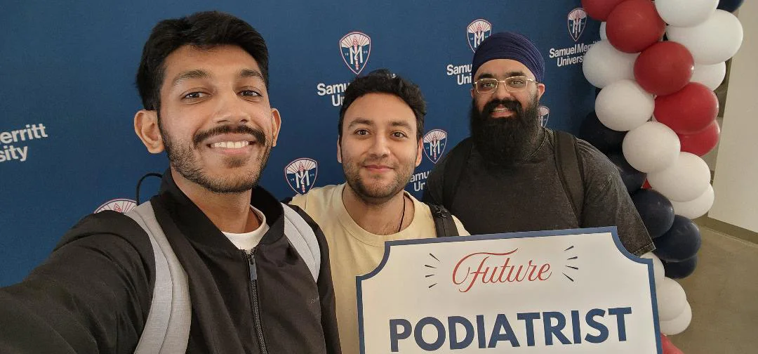 Jagir with two classmates holding a Future Podiatrist sign at Samuel Merritt University